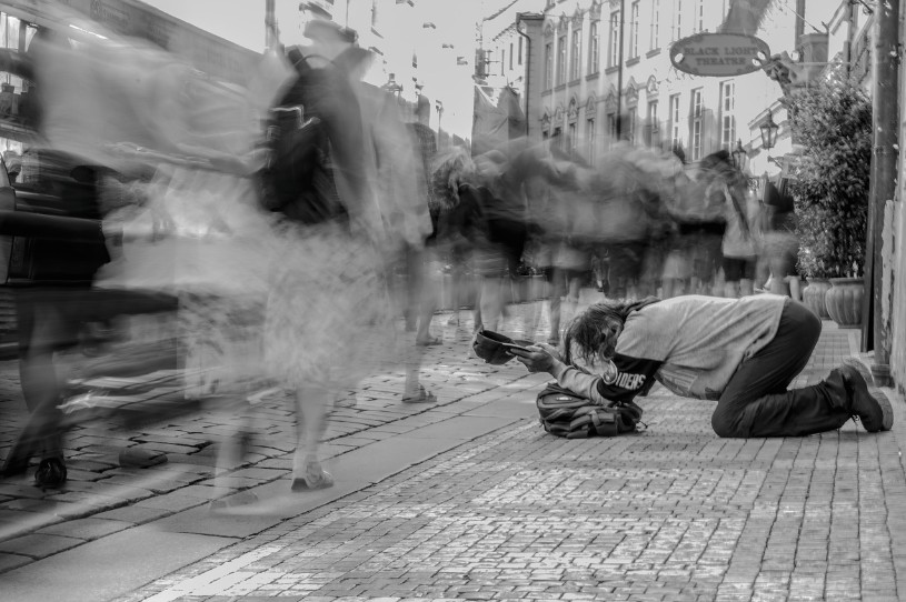 By just flowing in the stream of life, we may perpetuate wetiko behaviors where it's socially accepted to exclude and reject certain persons. A homeless beggar shows one of the faces of the social exclusion issue that is currently beating our society.