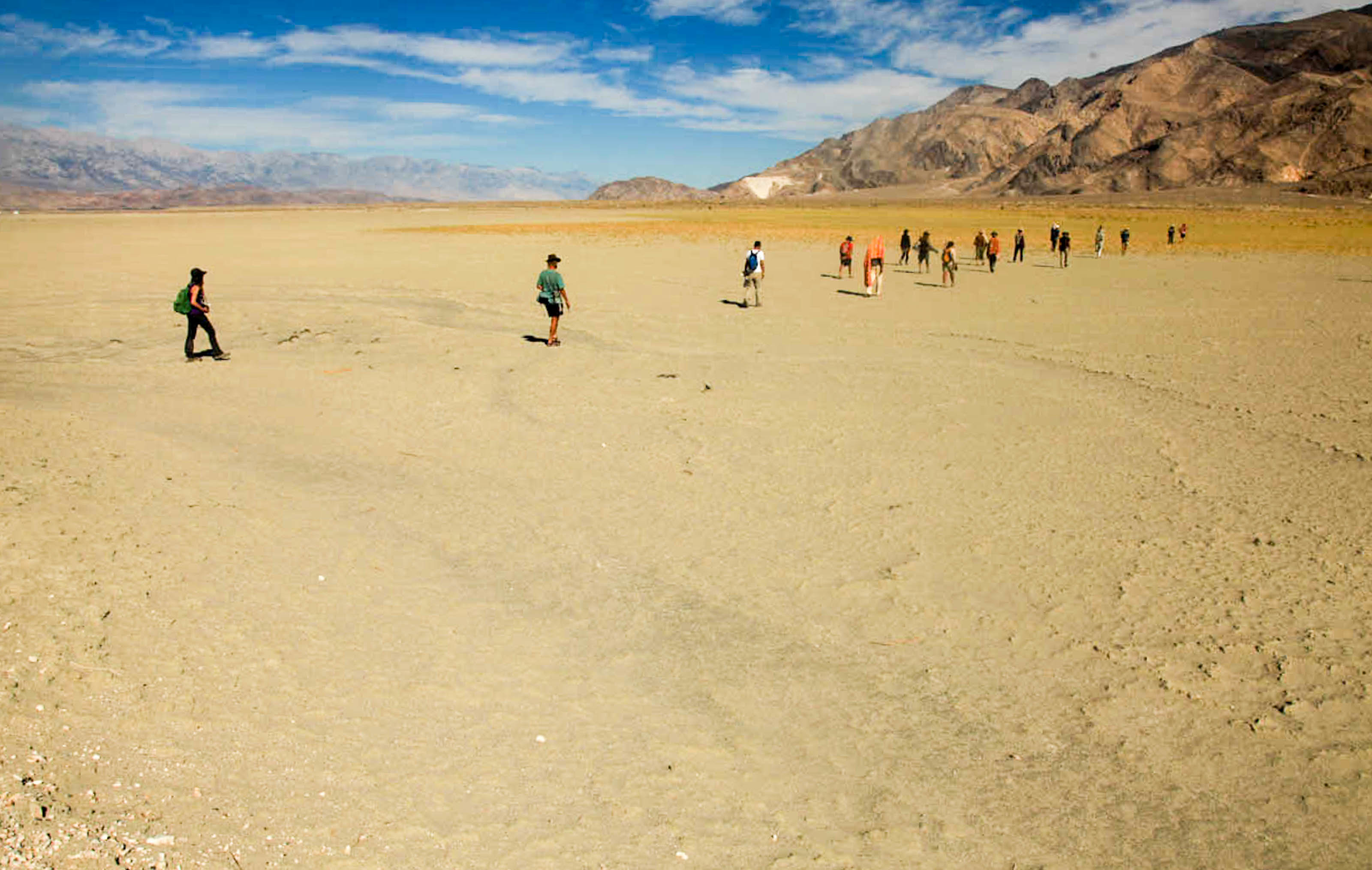 Walking Water pilgrims walking across a dry lake bed