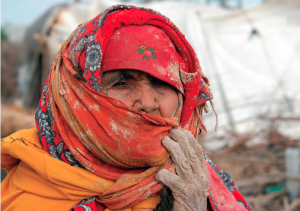 Elderly Pakinstani woman's home is destroyed by a powerful flood in the Gaza Strip.