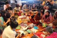 When we say we're throwing something out, what do we mean by 'out'?" Participants get to work on making objects out of old pieces of 'rubbish', as part of a workshop encouraging them to reflect on the high levels of waste generated by our consumer lifestyles.